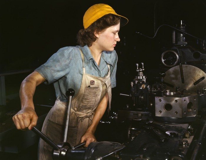A factory worker during World War II (Public Domain)