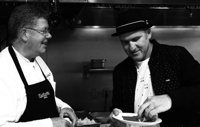 Wil-Dog, left, eats a taco at Jimmy Shaw’s Lotería Grill on Hollywood Boulevard