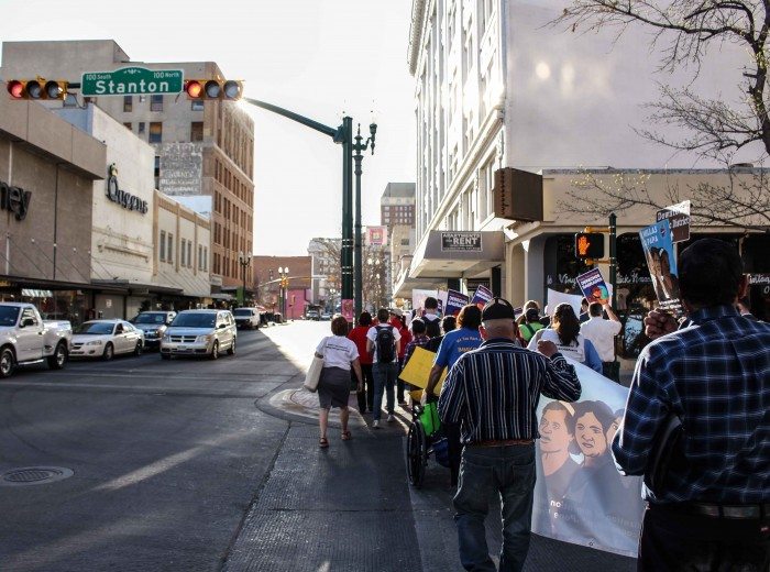 A delegation walks through Downtown El Paso. (Maria Esquinca)