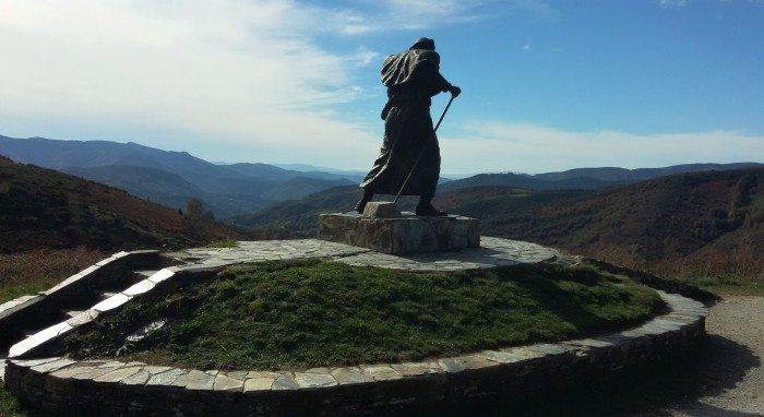 Statue of a windswept pilgrim on Alto de Roque, Galicia