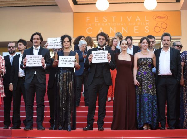 The Cannes red carpet was the scene of an unusual political protest as the cast and crew of the Brazilian film 'Aquarius' held banners denouncing the suspension of Dilma Rousseff as a 'coup d'etat."